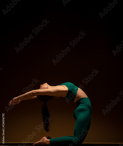 Stretching her back on the ground while focusing