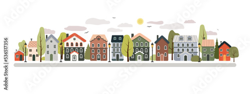 Houses in the old town, city street. Summer sunny day. Multi-colored funny houses, trees, clouds, road. Summer urban landscape. Vector baby illustration.