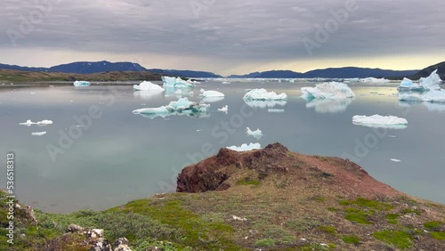 Panoramic view of the fjords of Narsaq, Greenland, with drifting icebergs from the nearby glaciers. Narsaq, Southern Greenland photo