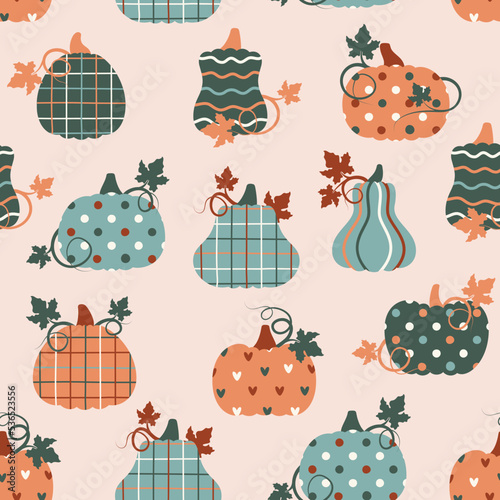 Seamless pattern with patchwork pumpkins with different prints on them. Vector illustration.