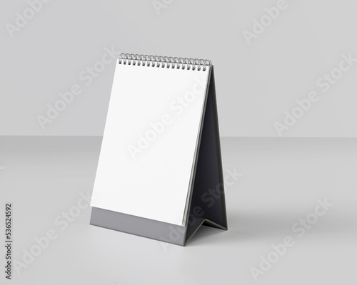 Portrait table calendar mockup with black stand isolated on white background. 3D Illustration.