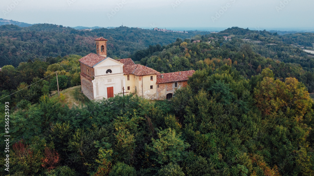 Christian church in Piedmont hills, Northern Italy, aerial view. Autumn landscape.