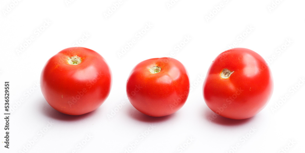 three tomatoes isolated on white three tomatoes isolated on white