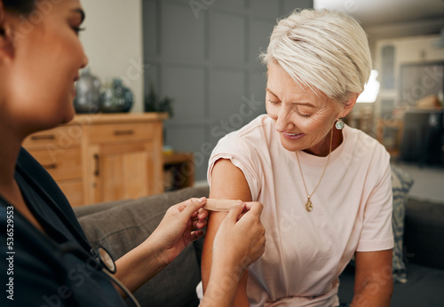 Fotografie Covid vaccine, plaster and doctor with patient in a health consultation at a retirement house