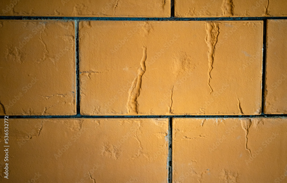 Ceramic tiles for facing furnaces. Photo of orange heatresistant tiles