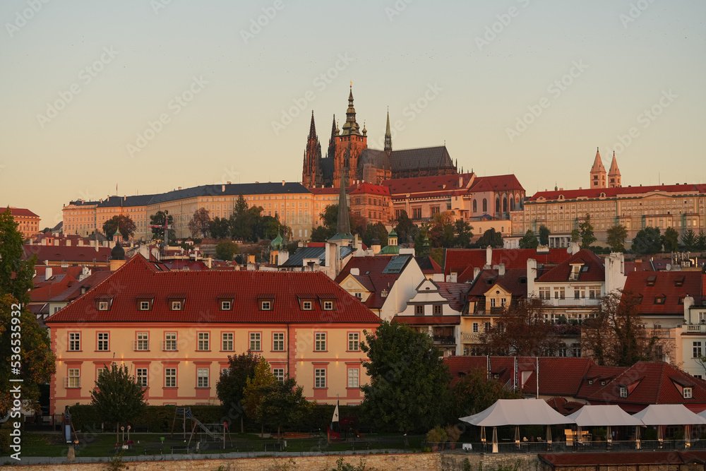 Sunrise over Prague Castle and Saint Vitus Cathedral, amazing warm autumn light early in the morning. Travel to Czech republic.
