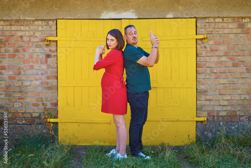 Lovely pregnant couple walking in a park