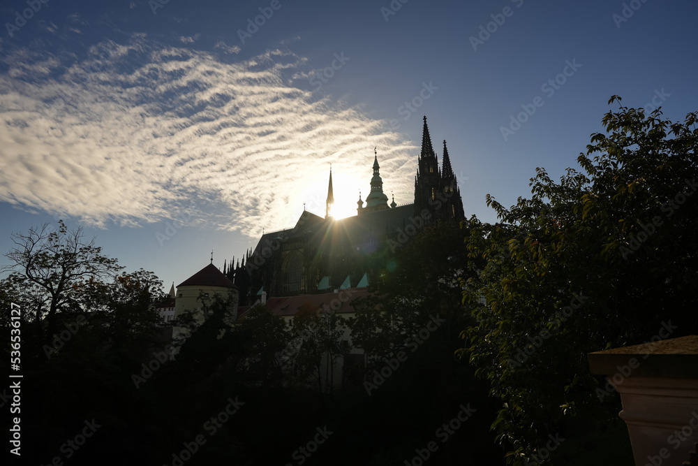 Spectacular clouds over Prague Castle and Saint Vitus Cathedral during an autumn morning. Travel to Czech Republic, visit the architecture landmark of Prague, wide view of the towers.