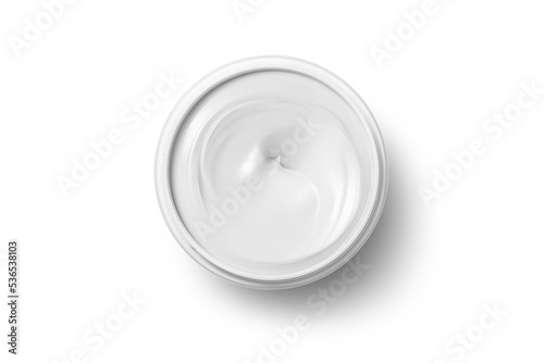 丸い容器に入った白いクリーム状の化粧品