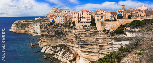 Bonifacio - splendid coastal town  in south of Corsica island, aerial drone view of houses hanging over rocks. France photo