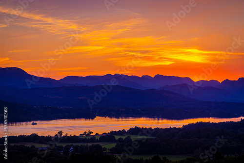View of sunset over Windermere in Lake District, a region and national park in Cumbria in northwest England © Alexey Fedorenko