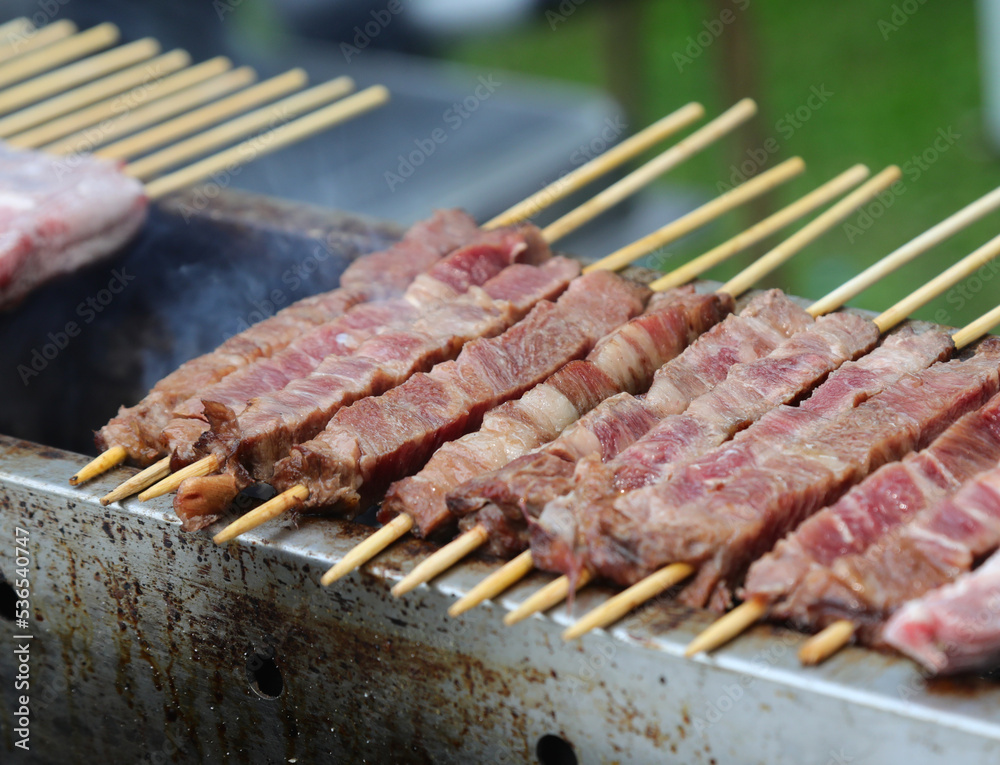 skewers of sheep and mutton cooked over the burning embers called ARROSTICINI in the Italian language