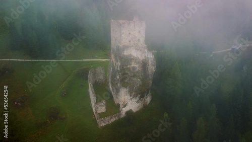 Old castle ruins in the fog, north of Italy, Castello di Andraz. photo