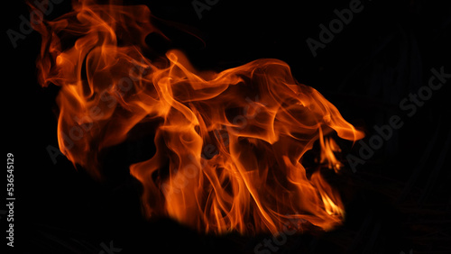 Stack of thermal energy close-up, red and yellow, heat energy igniting fuel during night/light on black background