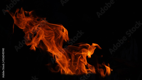 Stack of thermal energy close-up  red and yellow  heat energy igniting fuel during night light on black background