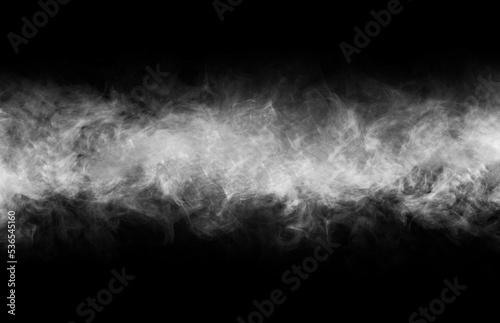 Abstract smoke texture frame over black background. Fog in the darkness. Natural pattern.