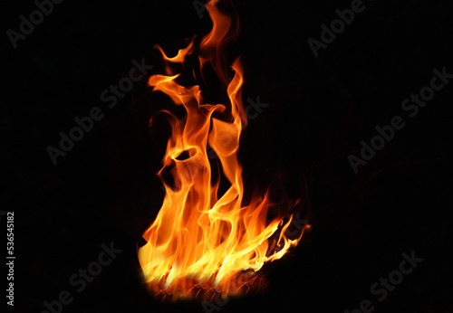 Stack of thermal energy close-up, red and yellow, heat energy igniting fuel during night/light on black background