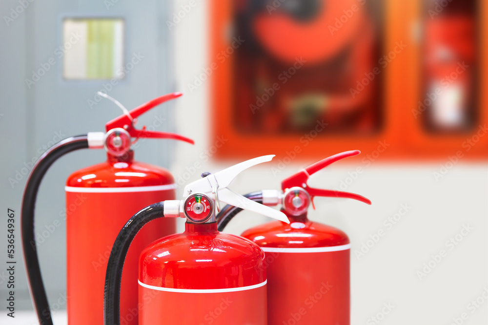 Fire extinguisher, Close-up red fire extinguishers tank in the building for fire equipment for extinguishing or protection and prevent for emergency and safety rescue and alarm system training.