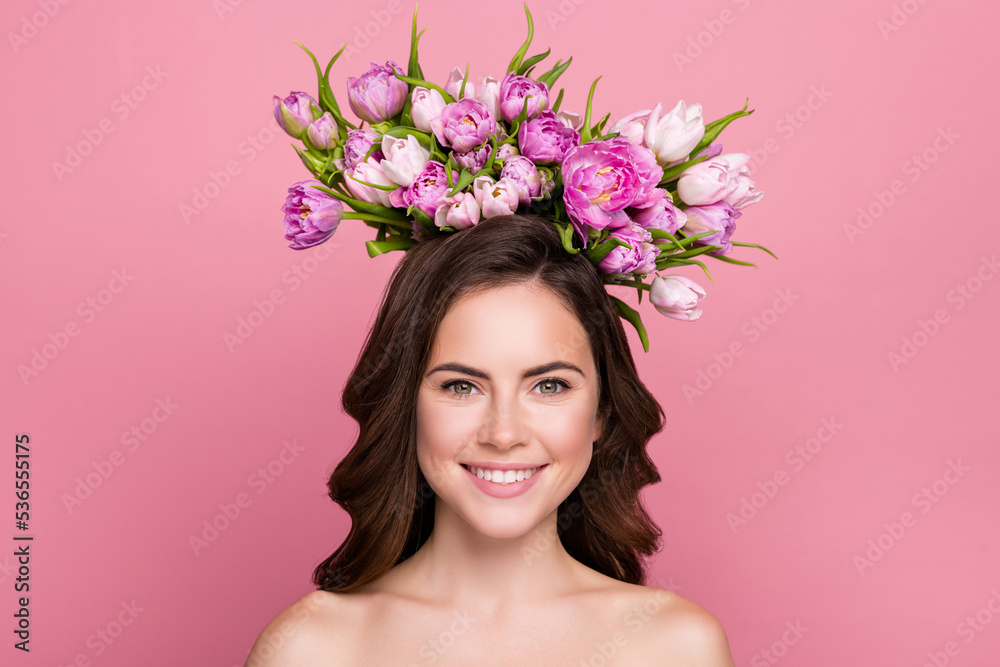 Photo of charming sweet young woman naked shoulders holding flowers blossom wreath isolated pink color background
