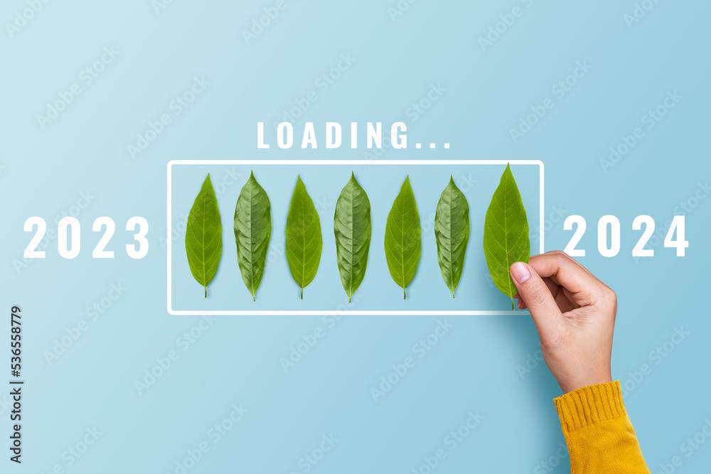 Hand putting leaf for countdown to 2025. Loading year 2023 to 2025