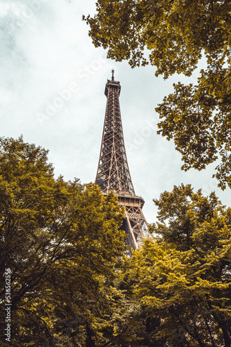 The famous Eiffel Tower in Paris with a dramatic sky