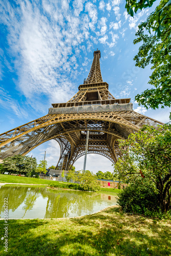 The famous Eiffel Tower in Paris with a dramatic sky