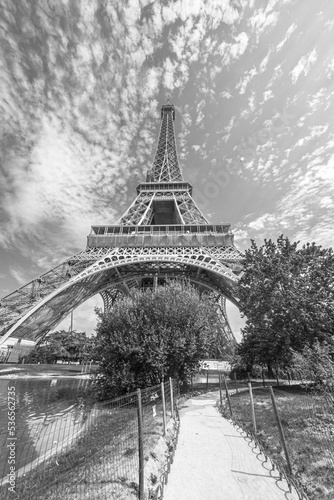 The famous Eiffel Tower in Paris with a dramatic sky