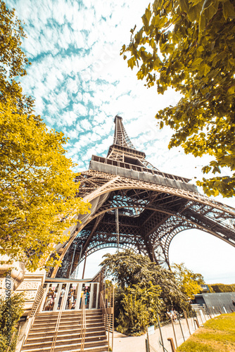 The famous Eiffel Tower in Paris with a dramatic sky