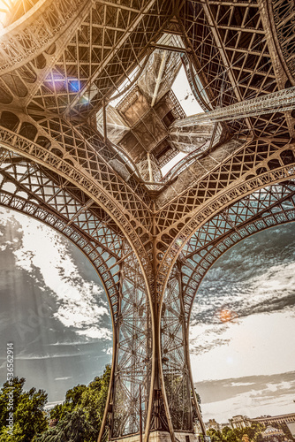The famous Eiffel Tower in Paris with a dramatic sky