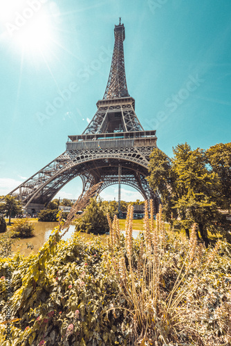 The famous Eiffel Tower in Paris with a dramatic sky
