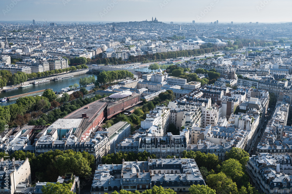 Panoramic view from second floor of Eiffel tower in Paris. View of the buildings, parks with historical Monmartre on the background