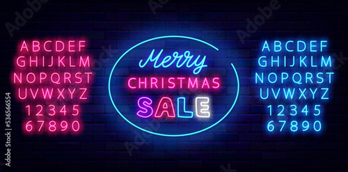 Merry Christmas sale neon signboard. Circle framen. Luminous pink and blue alphabet. Vector stock illustration photo