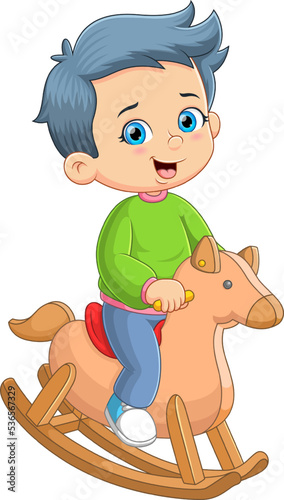 The little boy is playing the wooden horses and sitting on the saddle