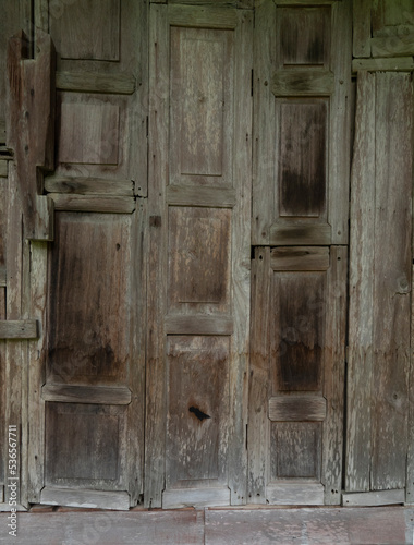 Pieces of old wood windows with some broke and stain.