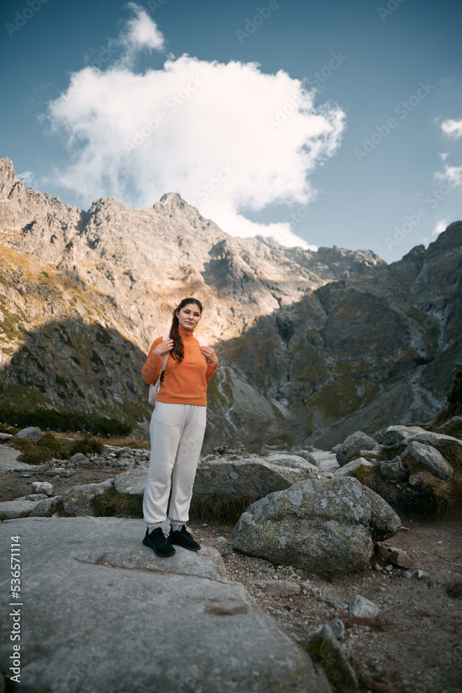 Girl in the mountains. A Caucasian woman is hiking. Concept of adventures in mountains. Girl in the mountains. A Caucasian woman is hiking. Concept of adventures in mountains.