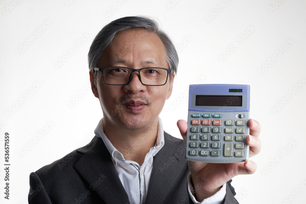 Chinese businessman holding a calculator with smile Chinese businessman holding a calculator with smile