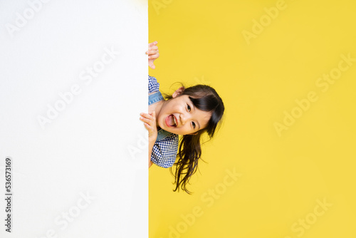 Photos beautiful asian girl portrait, isolated on yellow background