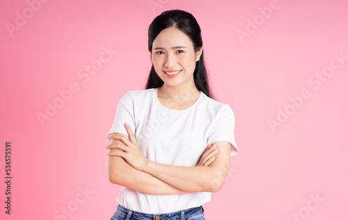 beautiful asian girl portrait, isolated on pink background