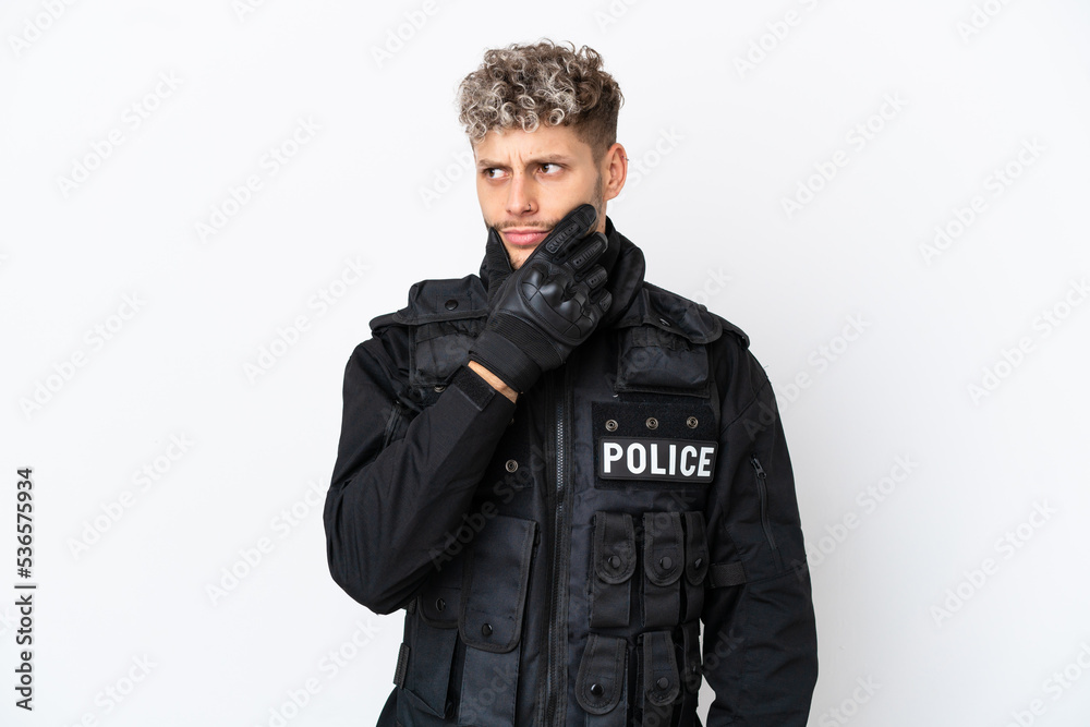 SWAT caucasian man isolated on white background having doubts and with confuse face expression SWAT caucasian man isolated on white background having doubts and with confuse face expression