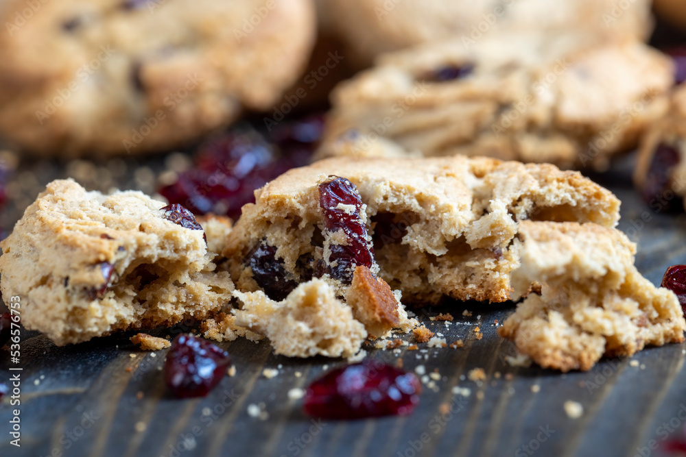 delicious dried cookies made of high-quality flour with dried red cranberries on the table delicious dried cookies made of high-quality flour with dried red cranberries on the table