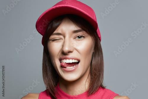 beautiful happy Girl in Pink Hat. funny young woman