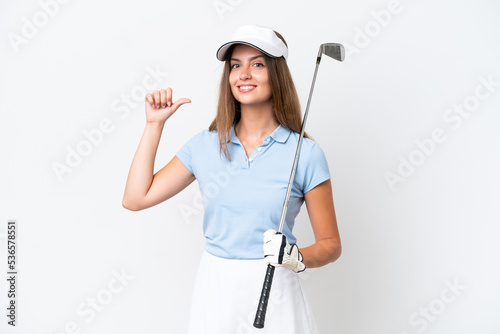 Young caucasian woman isolated on white background playing golf and proud of himself