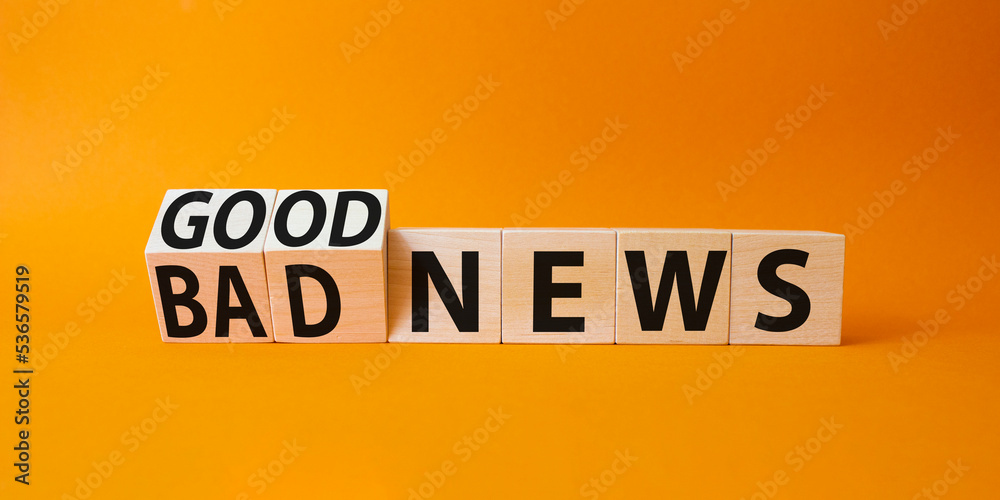 Good news and Bad news symbol. Turned wooden cubes with words Bad news and Good news. Beautiful orange background. Business concept. Copy space Good news and Bad news symbol. Turned wooden cubes with words Bad news and Good news. Beautiful orange background. Business concept. Copy space