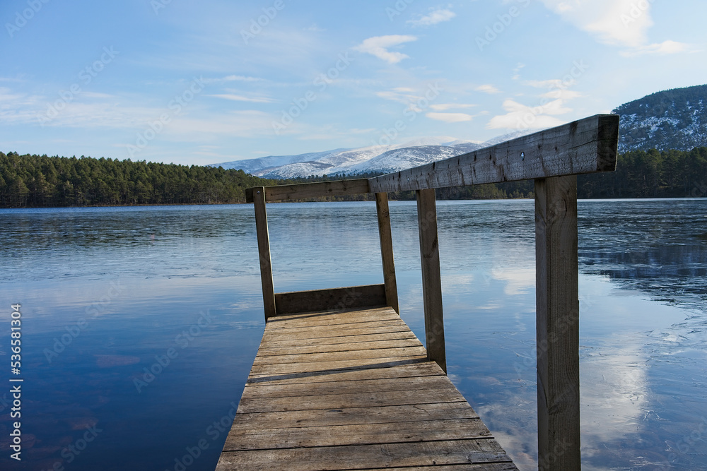 Fototapeta premium Boat Jetty on Loch An Eilean in the Highland region of the Cairngorms Scotland
