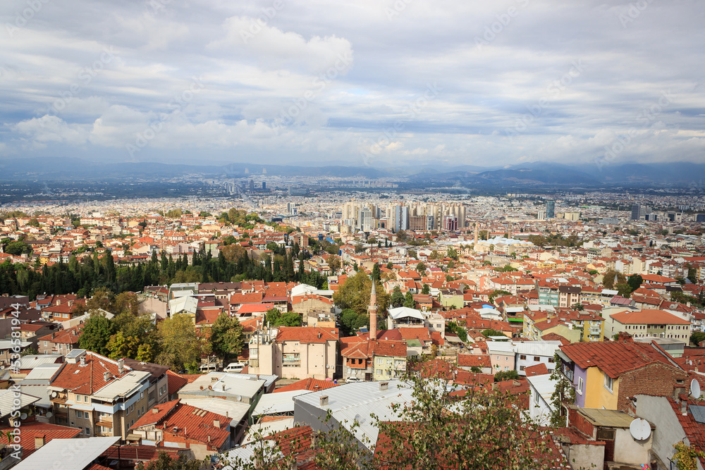 Aerial view of Bursa city with cloudy sky. Bursa is touristic destination in Turkey.