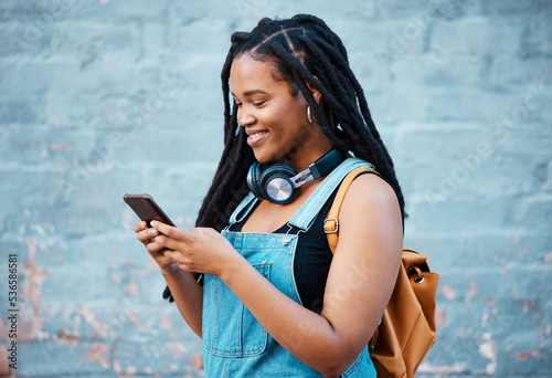 Billede på lærred Black woman, smile and phone of a student from Jamaica with technology and headphones