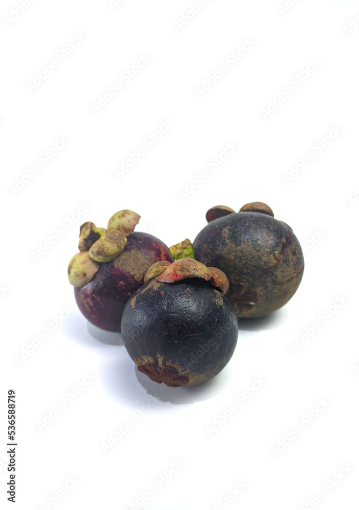Three mangosteen isolated on white background Three mangosteen isolated on white background