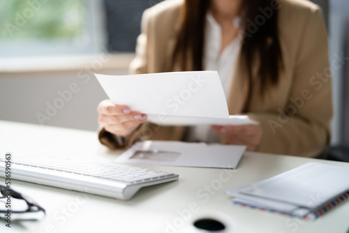 Woman Reading Paper Document
