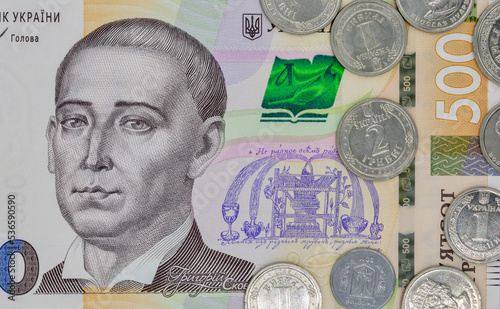 five hundred ukrainian hryvna banknote and coins closeup photo