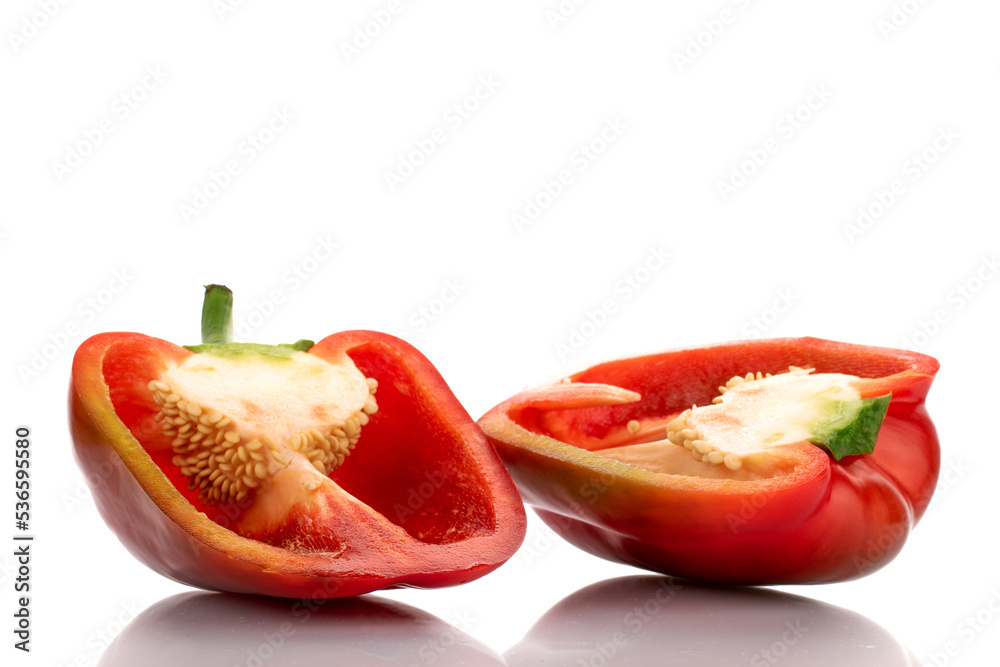 Two halves of red sweet pepper, close-up, isolated on white.